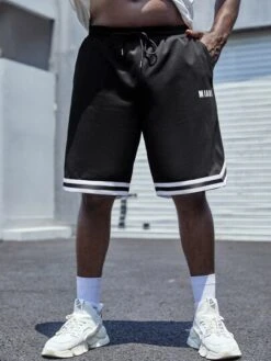 Manfinity Sporsity Men LetterGraphic Striped Trim Shorts -Man Plus Fashion 16509538884343aa4712605076278f23c44c555099 thumbnail 405x552