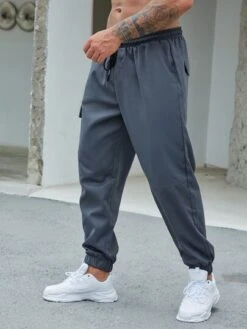 Manfinity Hypemode Men Patched Detail Flap Pocket Drawstring Waist Cargo Pants -Man Plus Fashion 1655261499c79e83b0796735a54889be201b185dd2 thumbnail 405x552