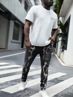 SHEIN Men Plus Cotton Graphic Print Ripped Skinny Jeans -Man Plus Fashion 16847492695db634a4527bcae93a756d8812696942 thumbnail 405x552