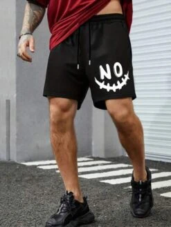 Manfinity LEGND Men Cartoon Graphic Drawstring Waist Shorts